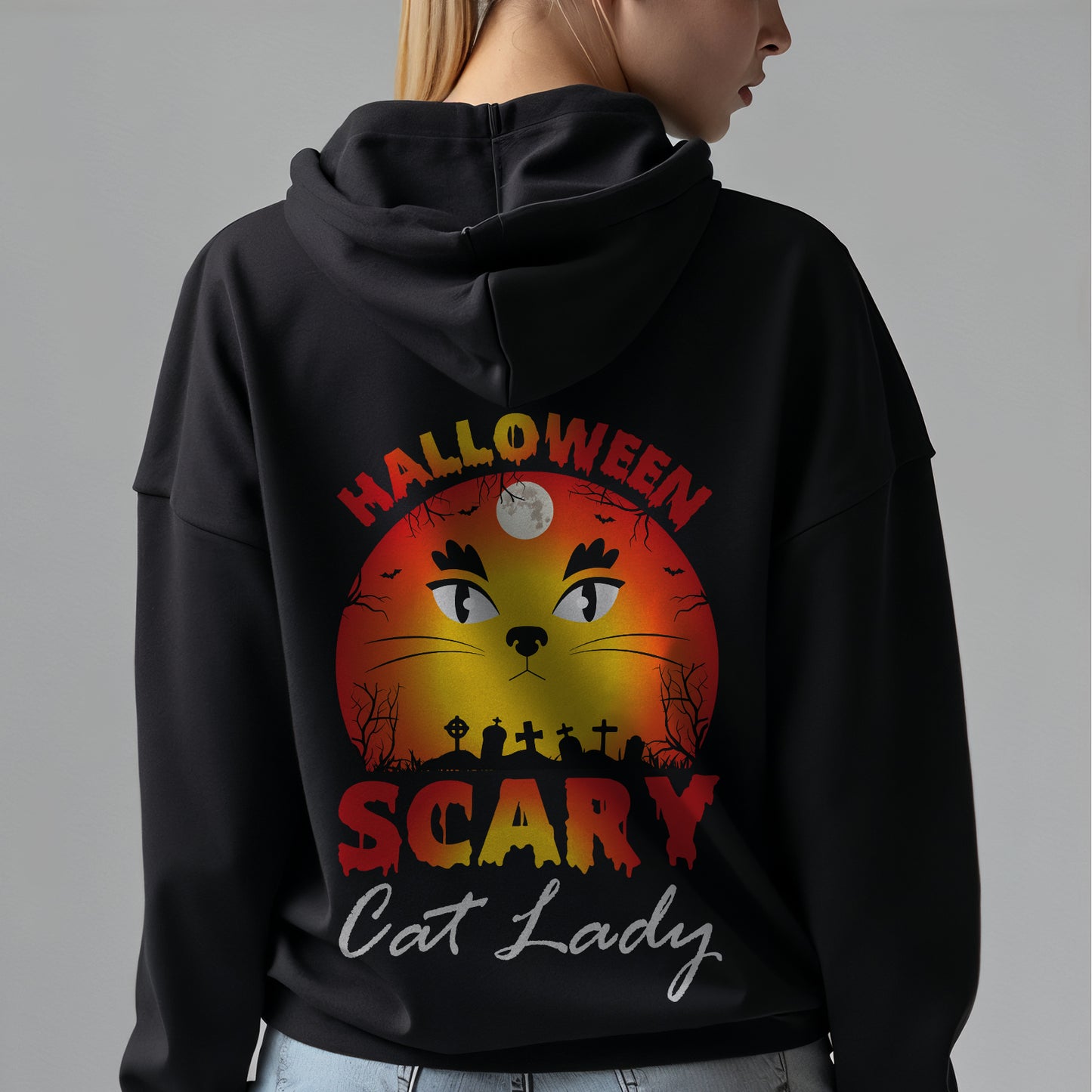 Custom Hoodies "Happy Halloween Collections featuring a cat and text on the back, worn by a person.